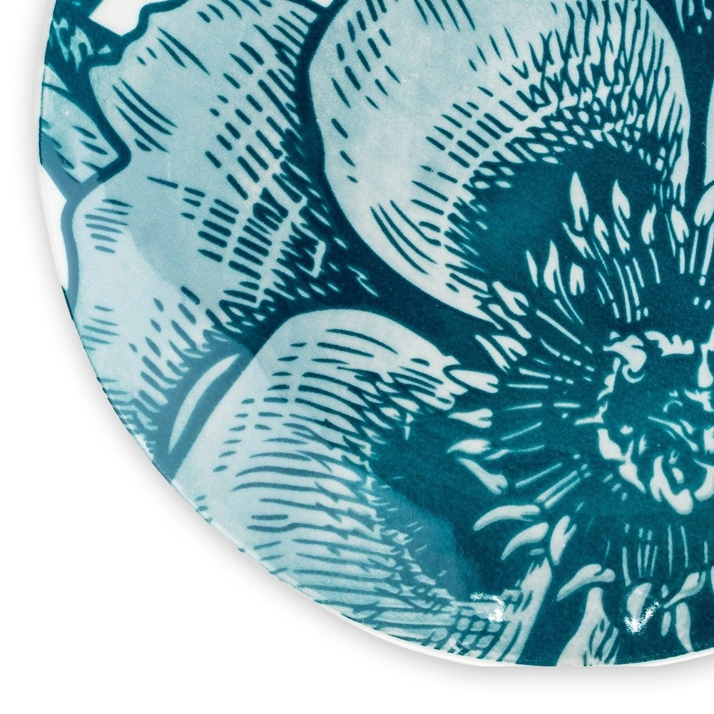 Beautiful white porcelain dish with turquoise floral motifs for desserts