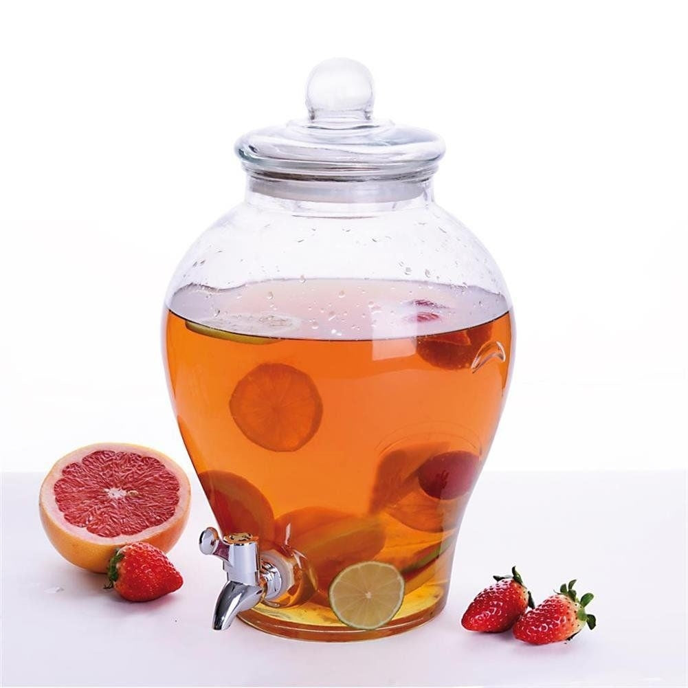 Beverage dispenser with faucet for lemonade or bonfire with pieces of fruit