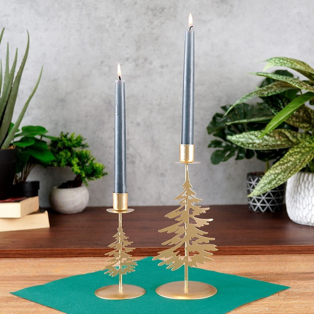 Classic golden candlestick with decorative metal fir tree