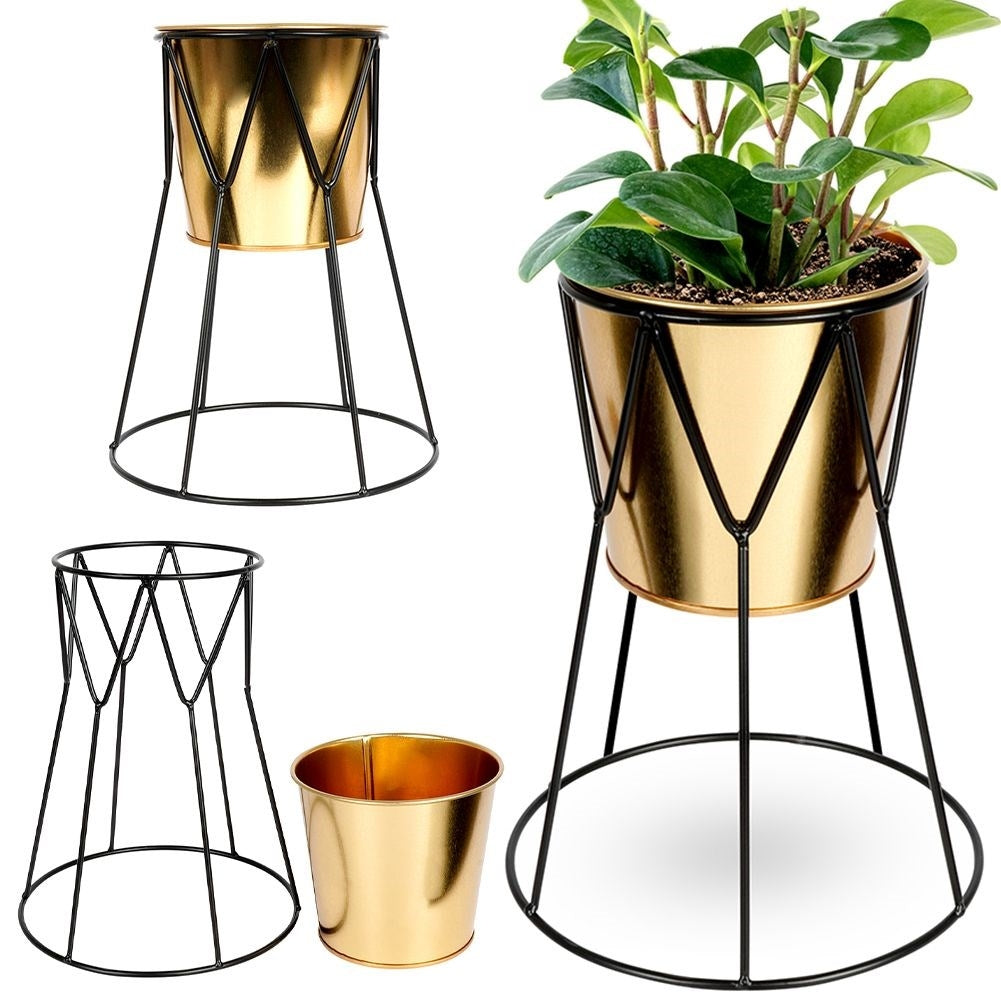 Elegant pot in gold with stylish black metal stand
