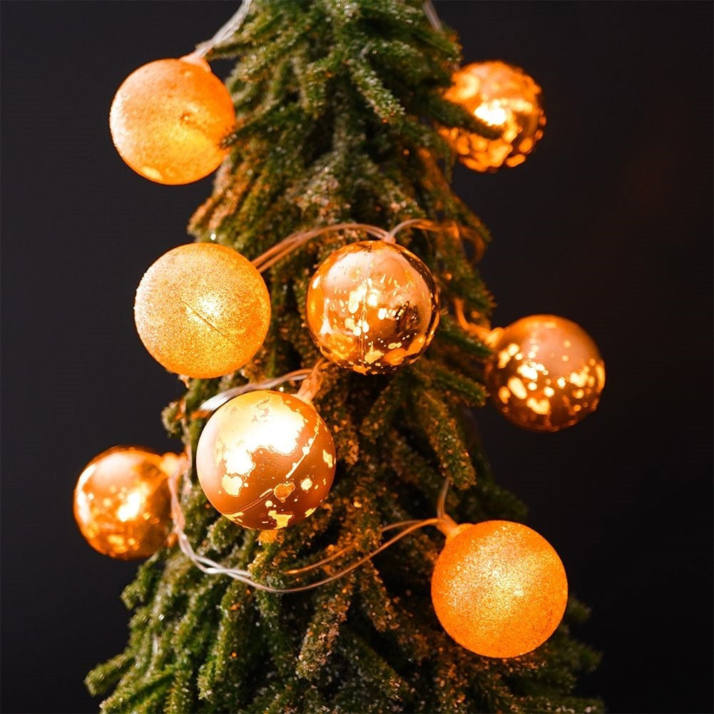 Golden LED Christmas tree balls for a festive atmosphere