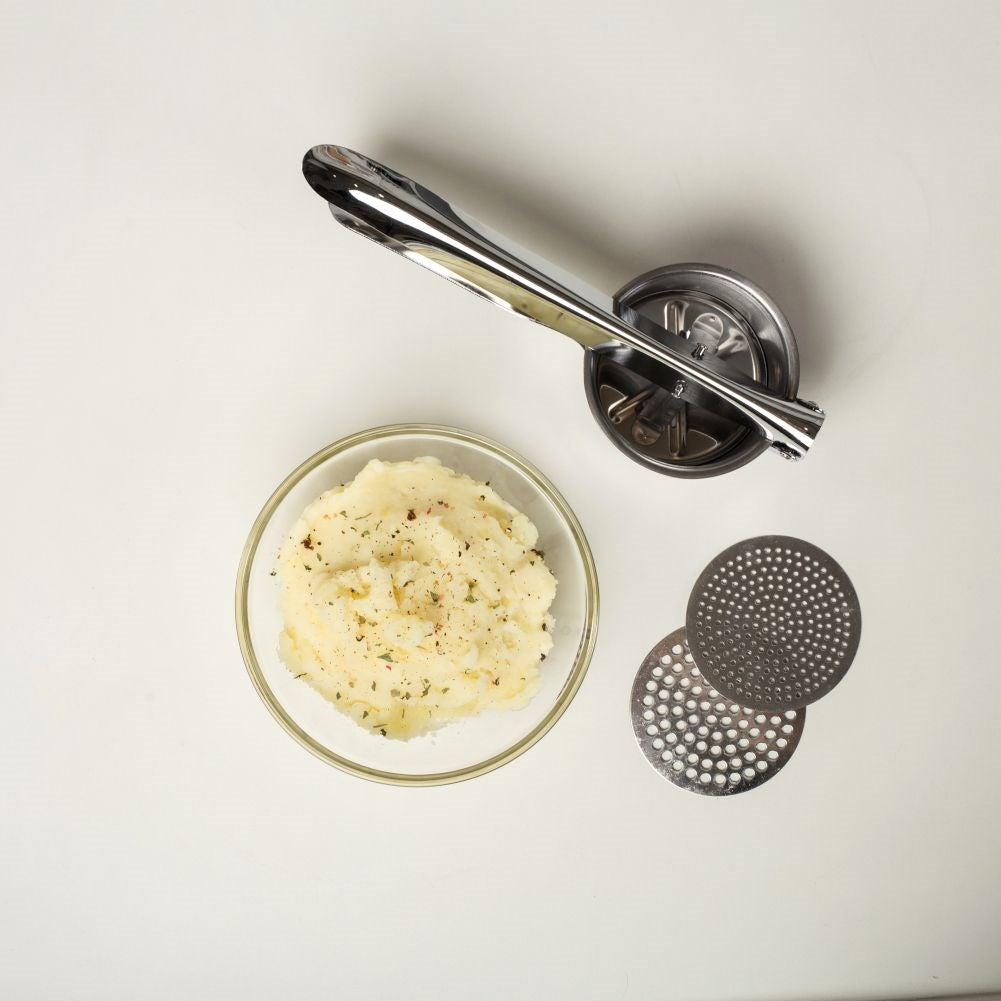 Potato press in stainless steel with two replaceable inserts