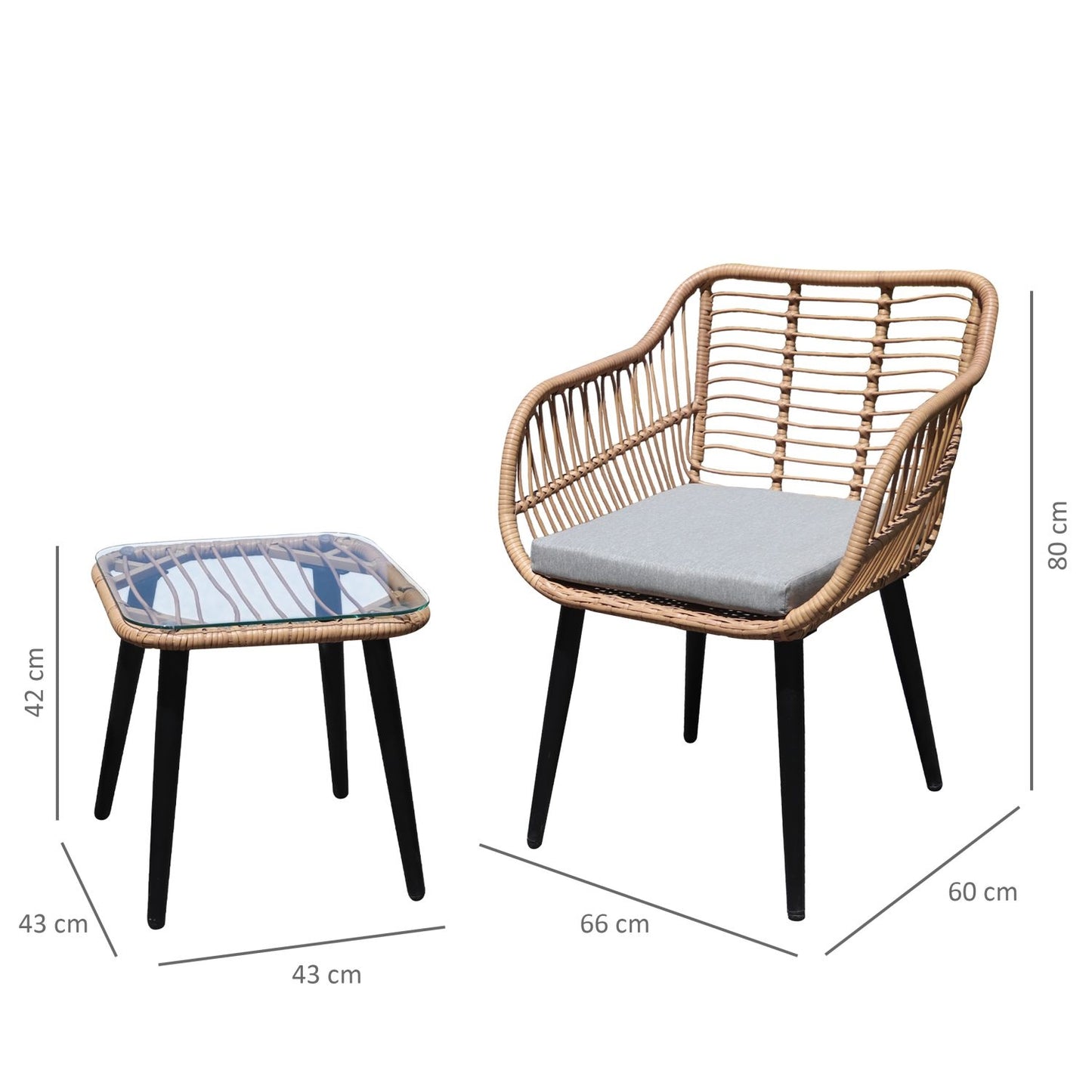 Rattan garden furniture set with chairs and a table with a glass top