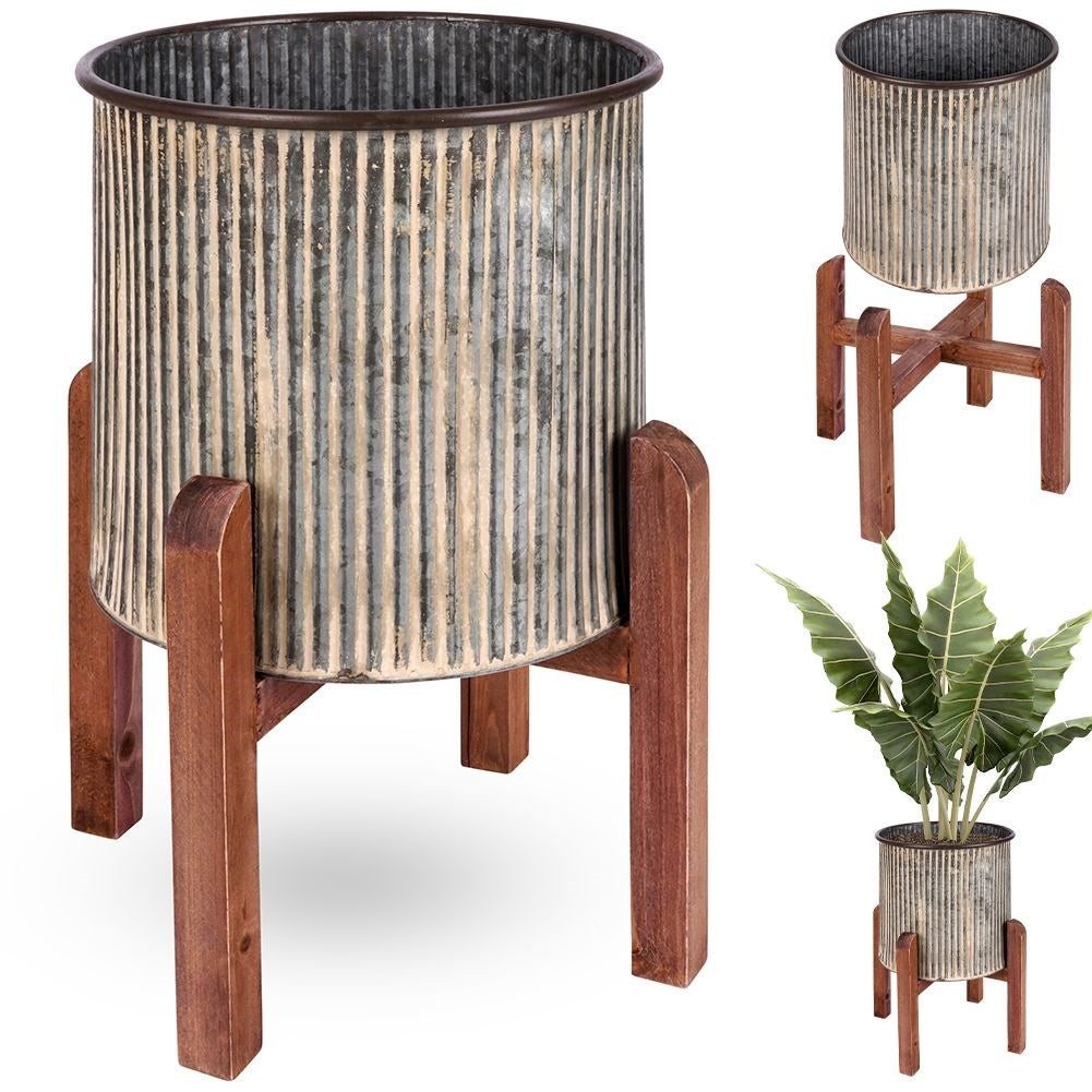 Steel flower pot with grooved surface on a wooden stand