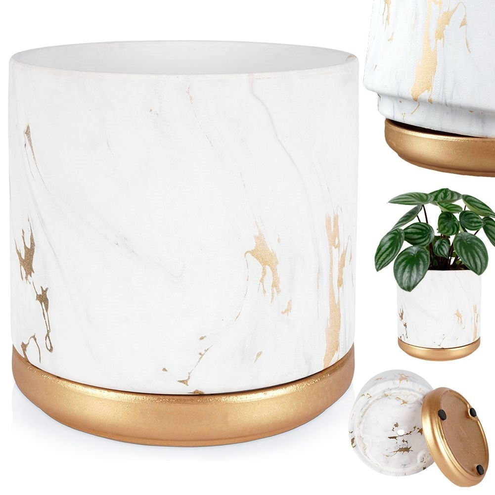 Stylish flower pot in a marble look with golden details