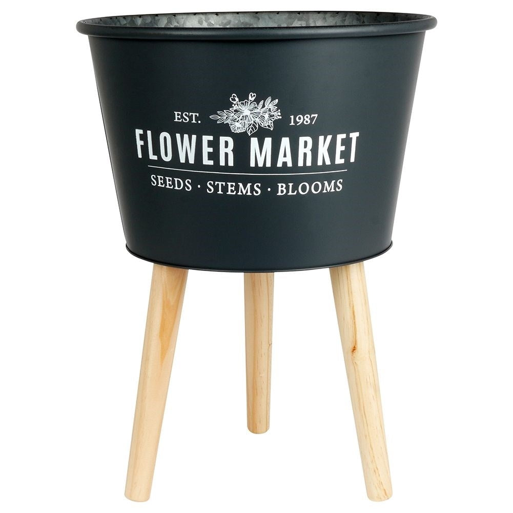 Stylish zinc pot on three legs in graphite color with text