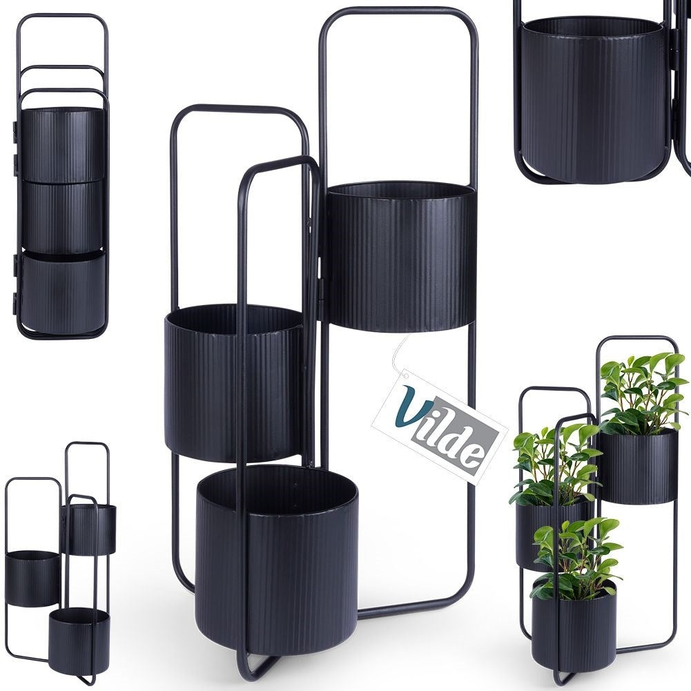 Three-legged flower stand in black metal for indoor use