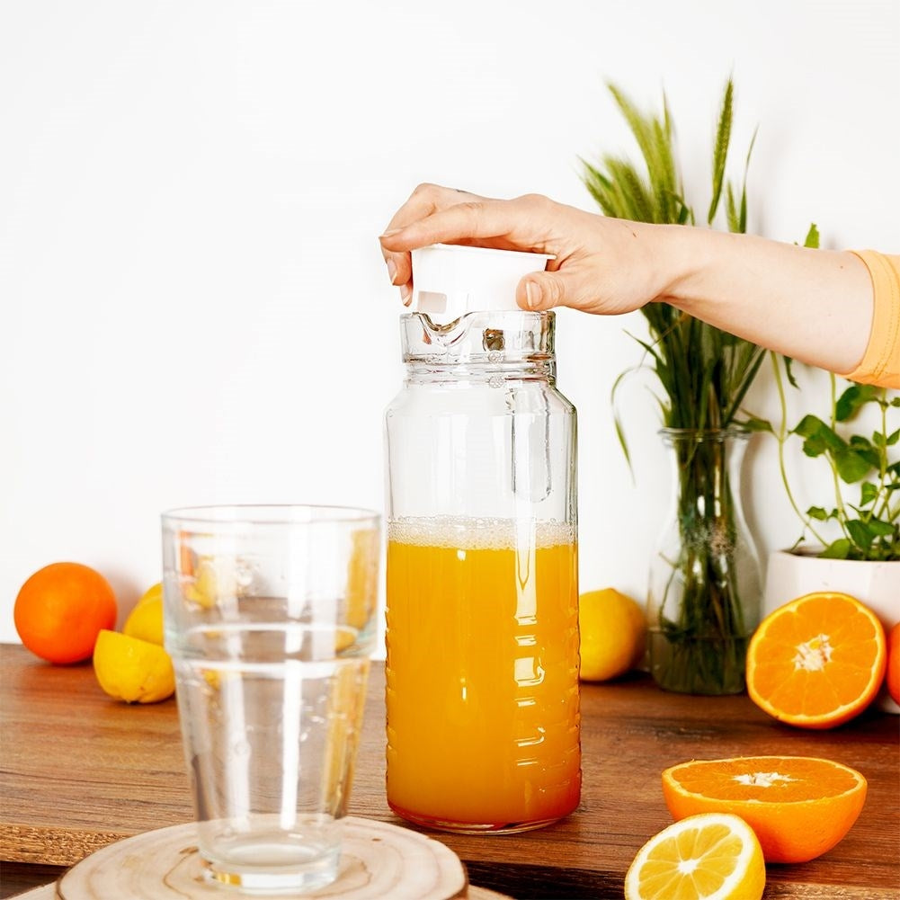 Versatile glass jug with lid, spout and comfortable handle