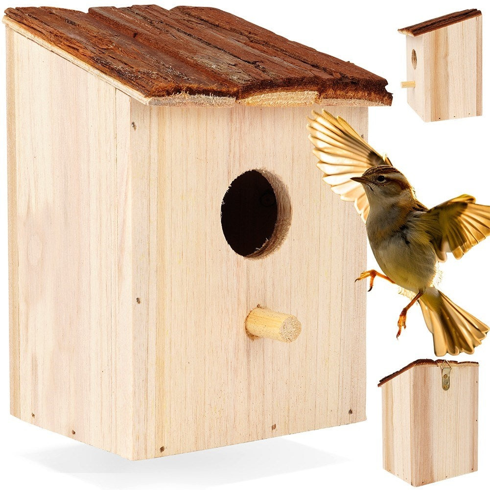 Wooden birdhouse with entrance opening for the garden