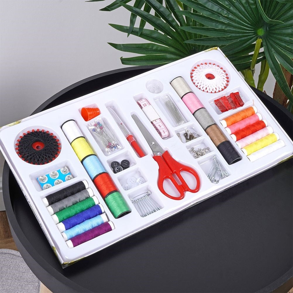 139-piece sewing kit: Thread, needles, scissors, buttons, measuring tape