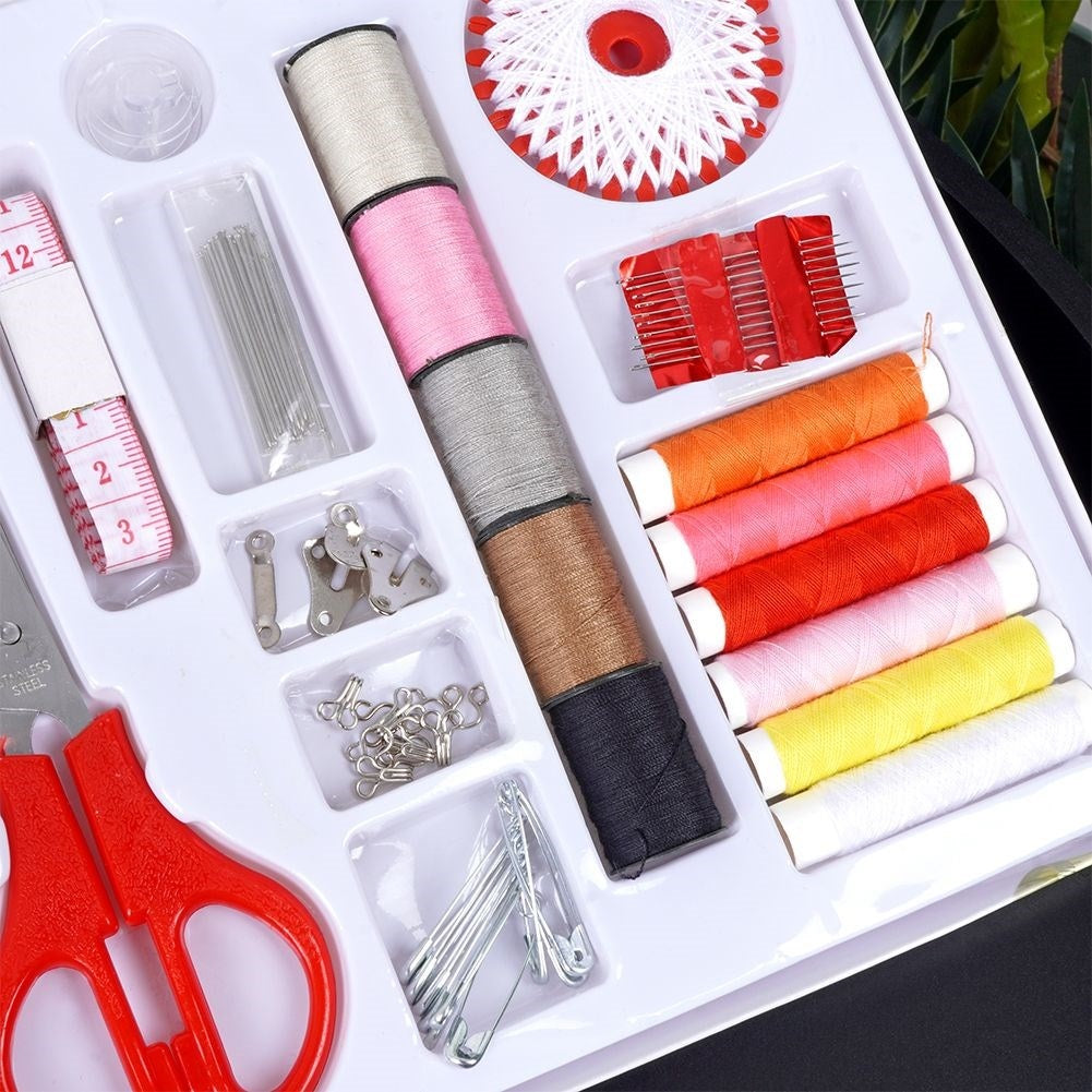 139-piece sewing kit: Thread, needles, scissors, buttons, measuring tape