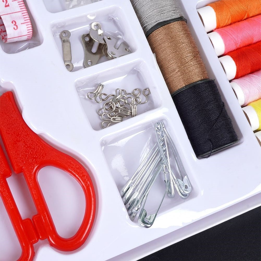 139-piece sewing kit: Thread, needles, scissors, buttons, measuring tape
