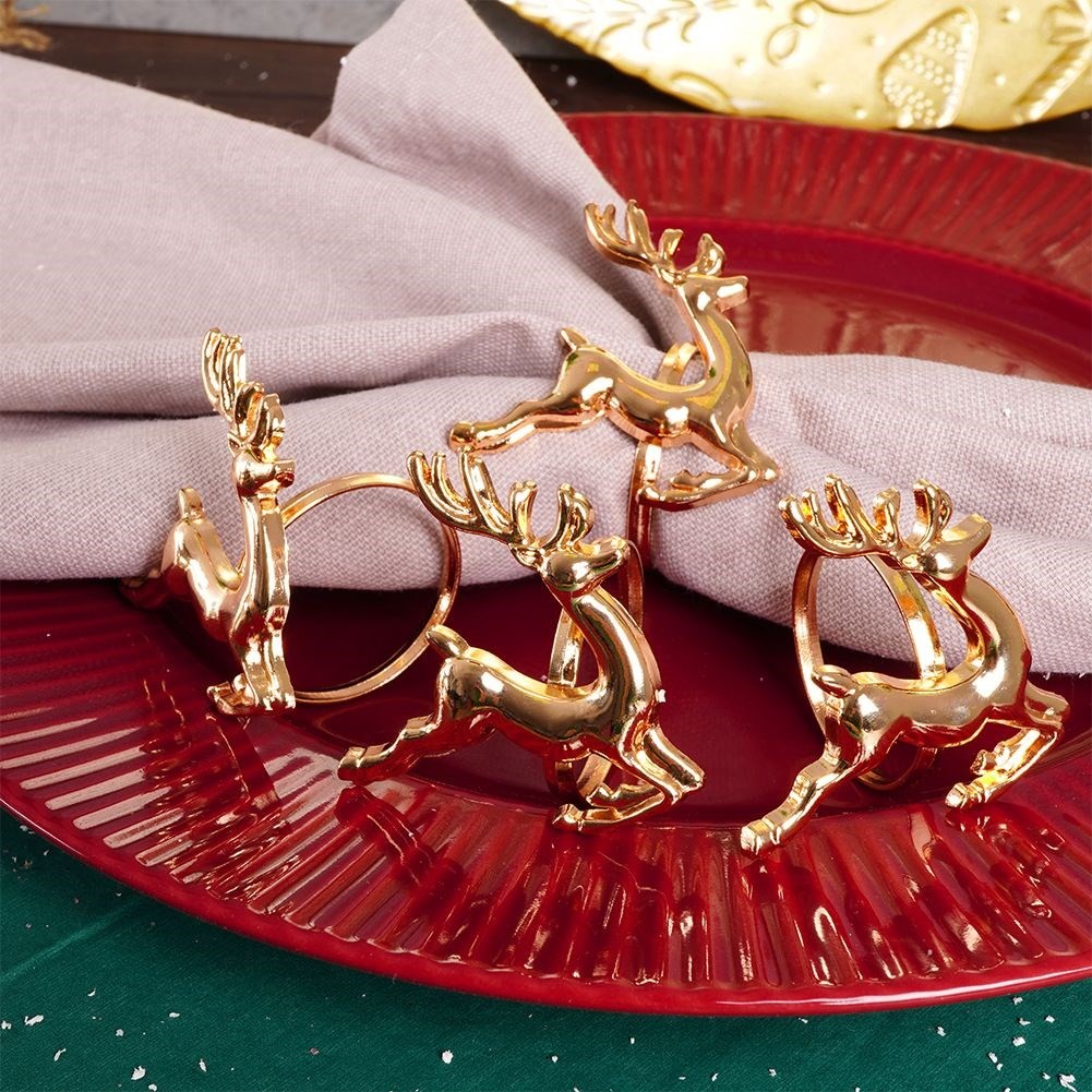 4 napkin rings in gold with reindeer, 4 cm diameter