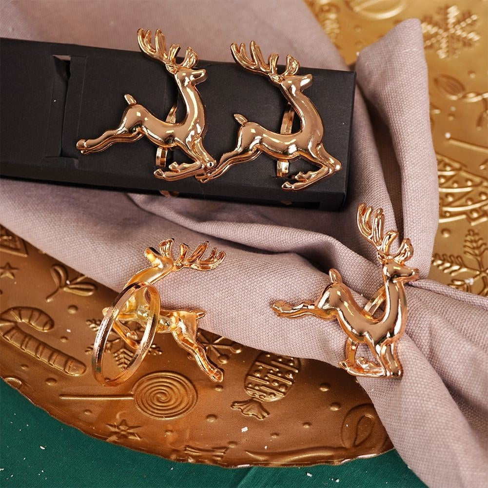 4 napkin rings in gold with reindeer, 4 cm diameter