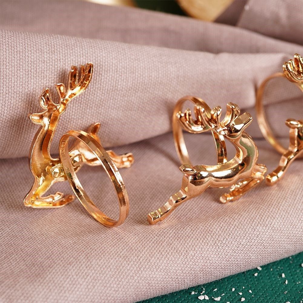 4 napkin rings in gold with reindeer, 4 cm diameter
