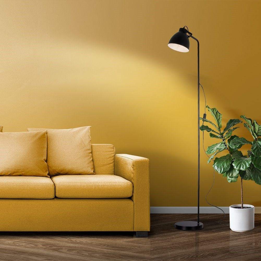 Adjustable black metal floor lamp with white interior