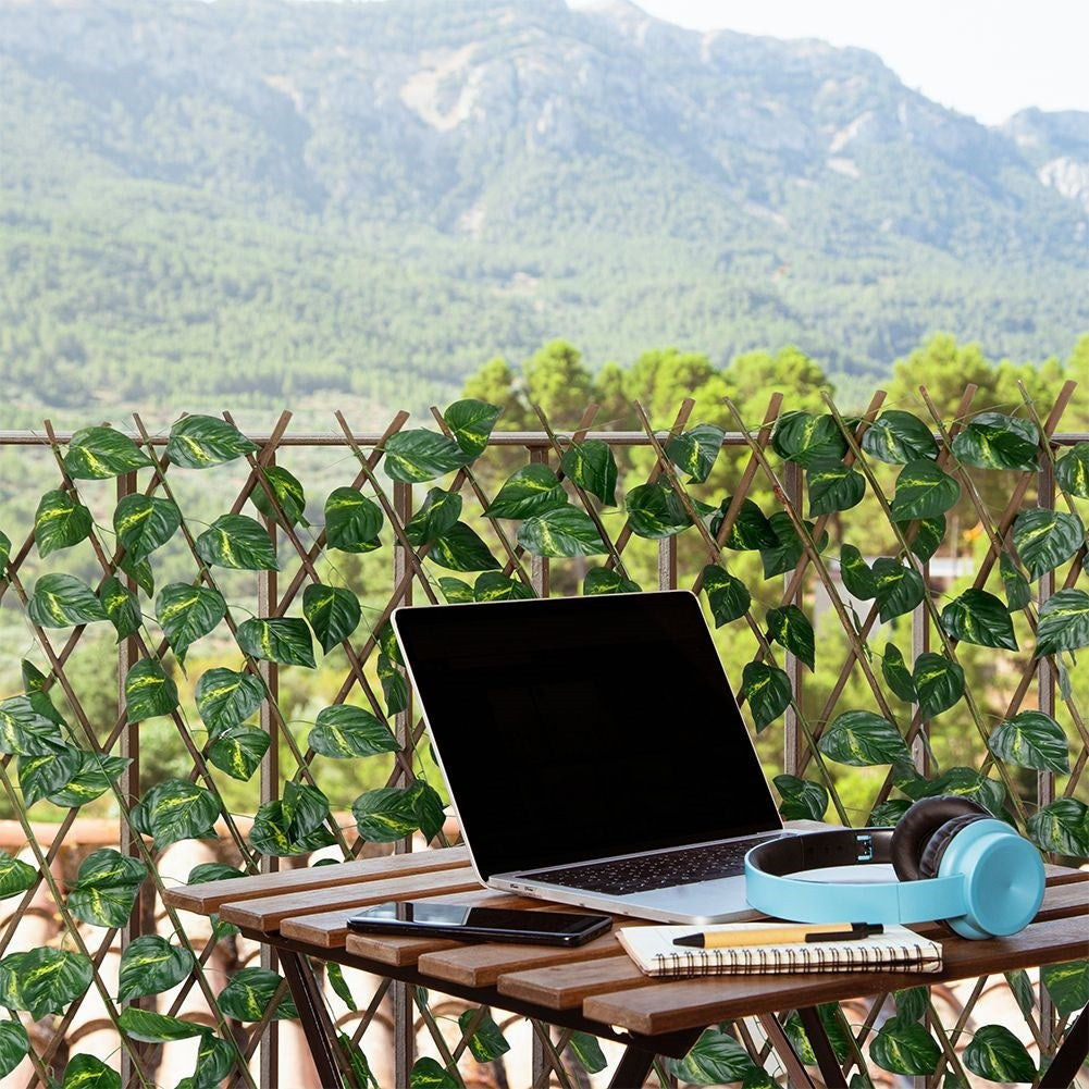 Adjustable decorative grille with artificial jasmine leaves