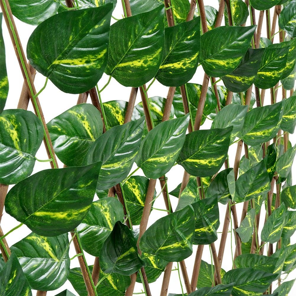 Adjustable decorative grille with artificial jasmine leaves
