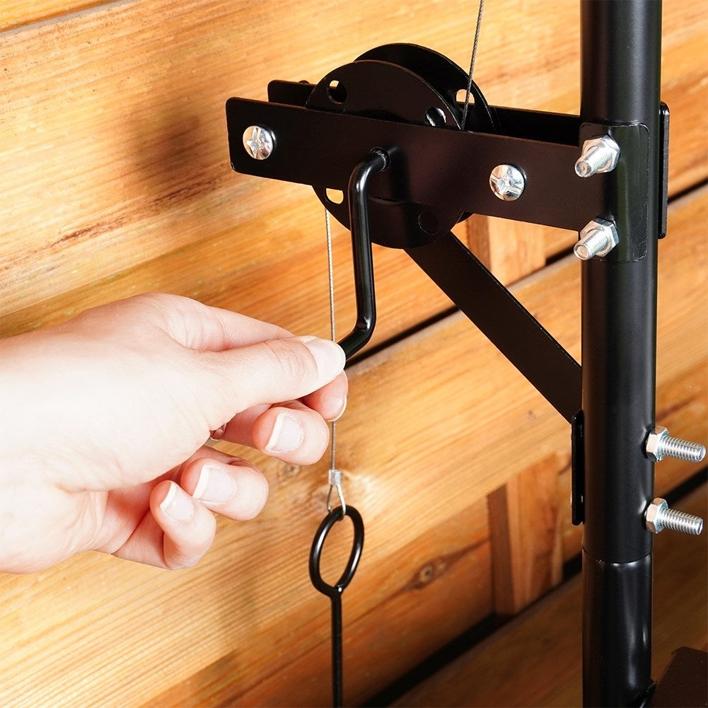 Adjustable metal fireplace with hanging grill grate for the garden