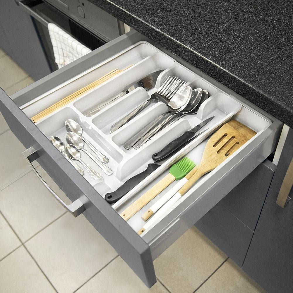 Adjustable white plastic cutlery organizer with 5-7 compartments