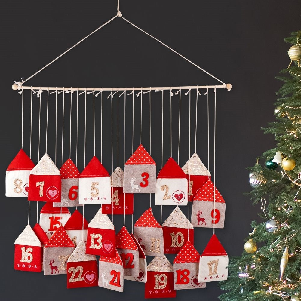Advent calendar with 24 houses on a wooden stick