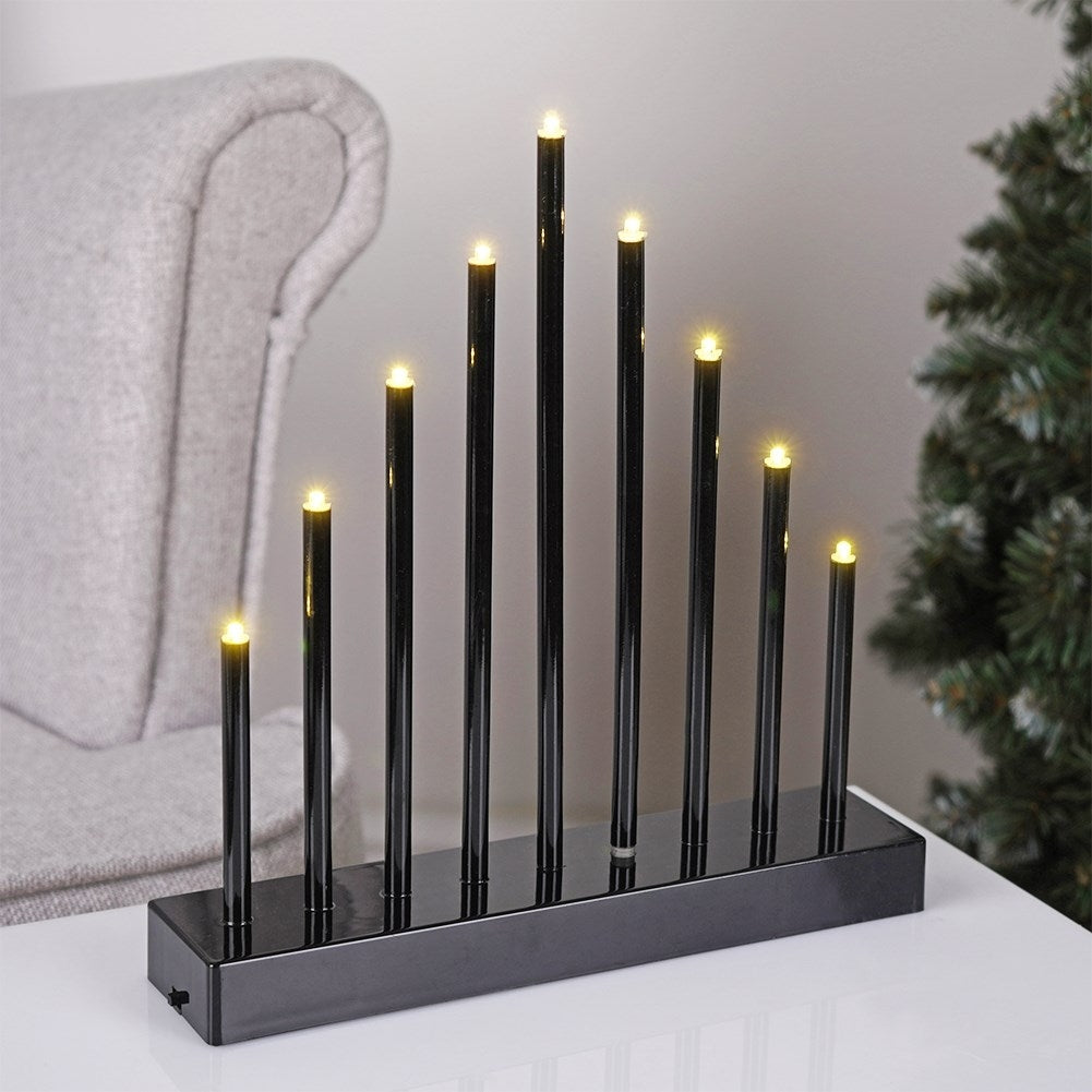 Advent candle holder with 9 LED lamps in black plastic