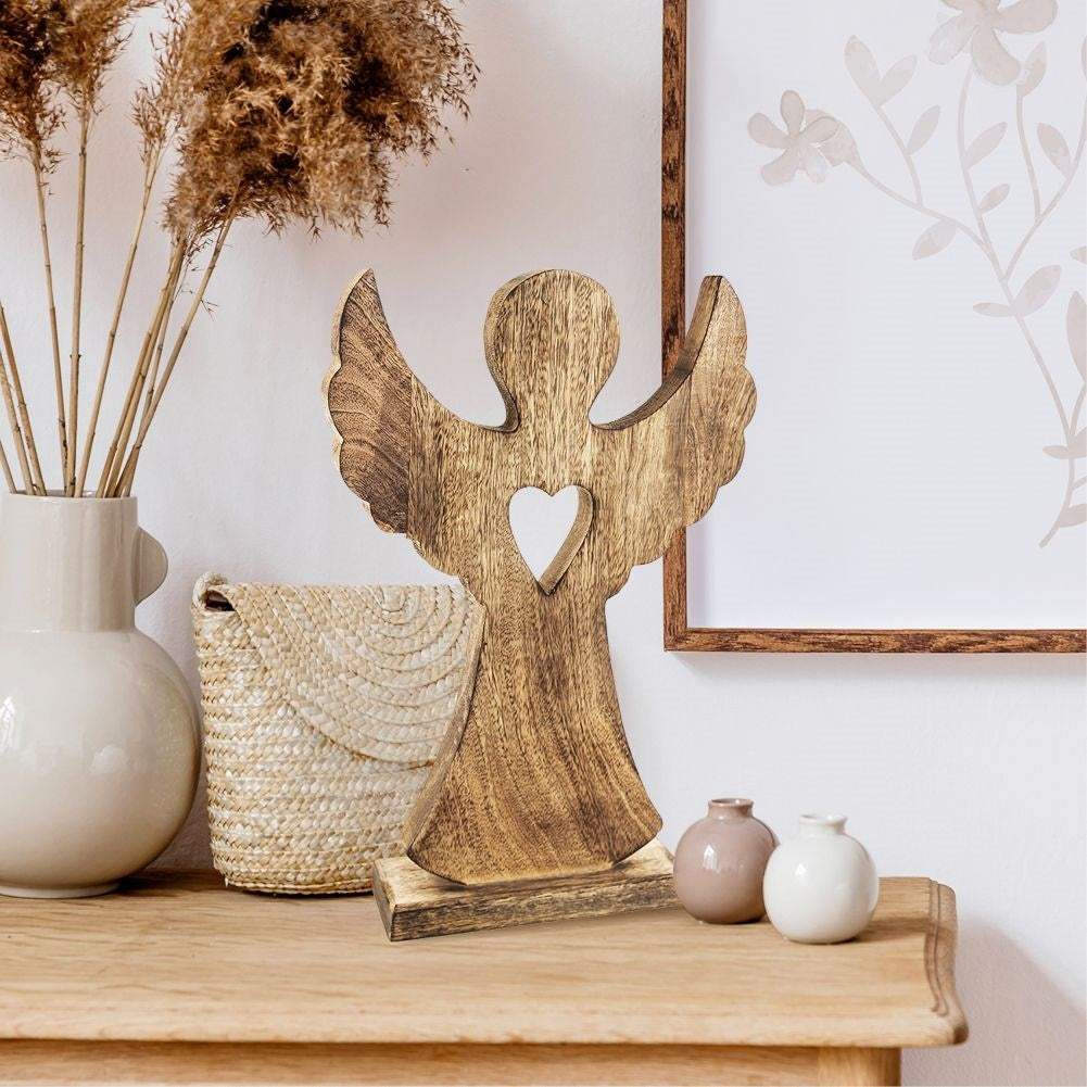 Angel in mango wood with heart - natural decoration