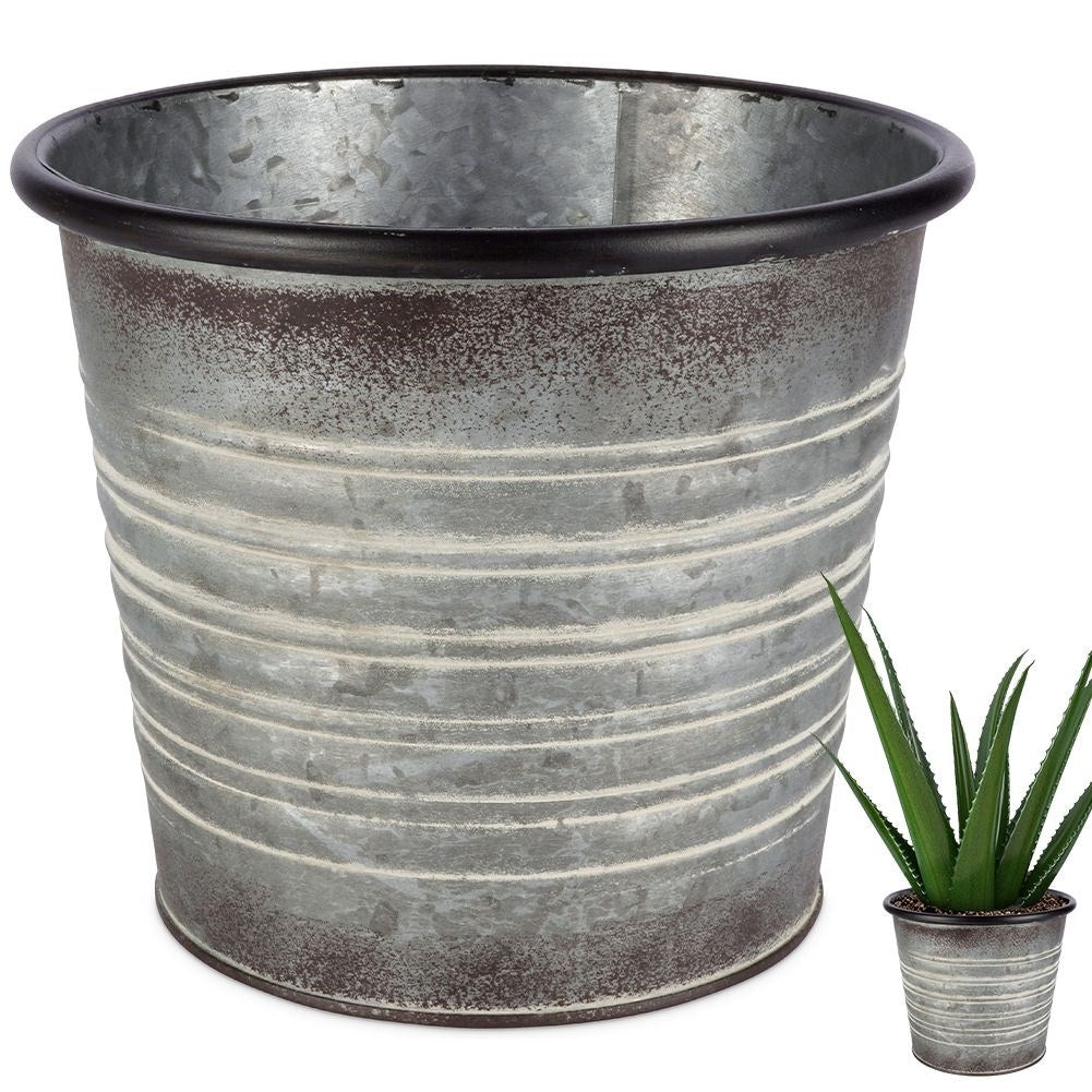 Antique galvanized metal pot with rusty finish