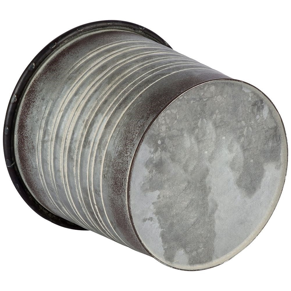 Antique galvanized metal pot with rusty finish