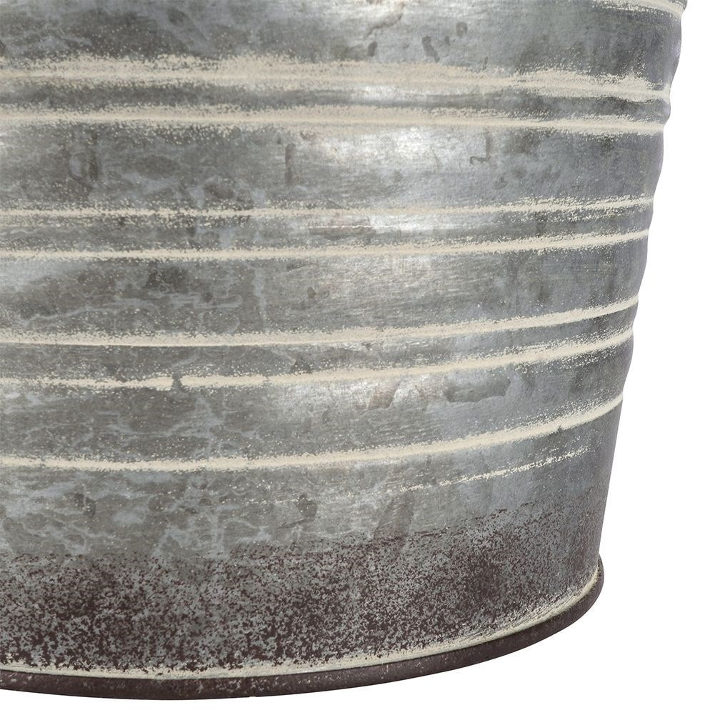 Antique galvanized metal pot with rusty finish
