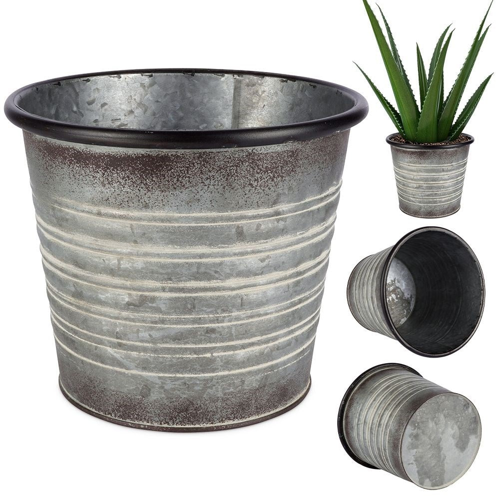 Antique galvanized metal pot with rusty finish