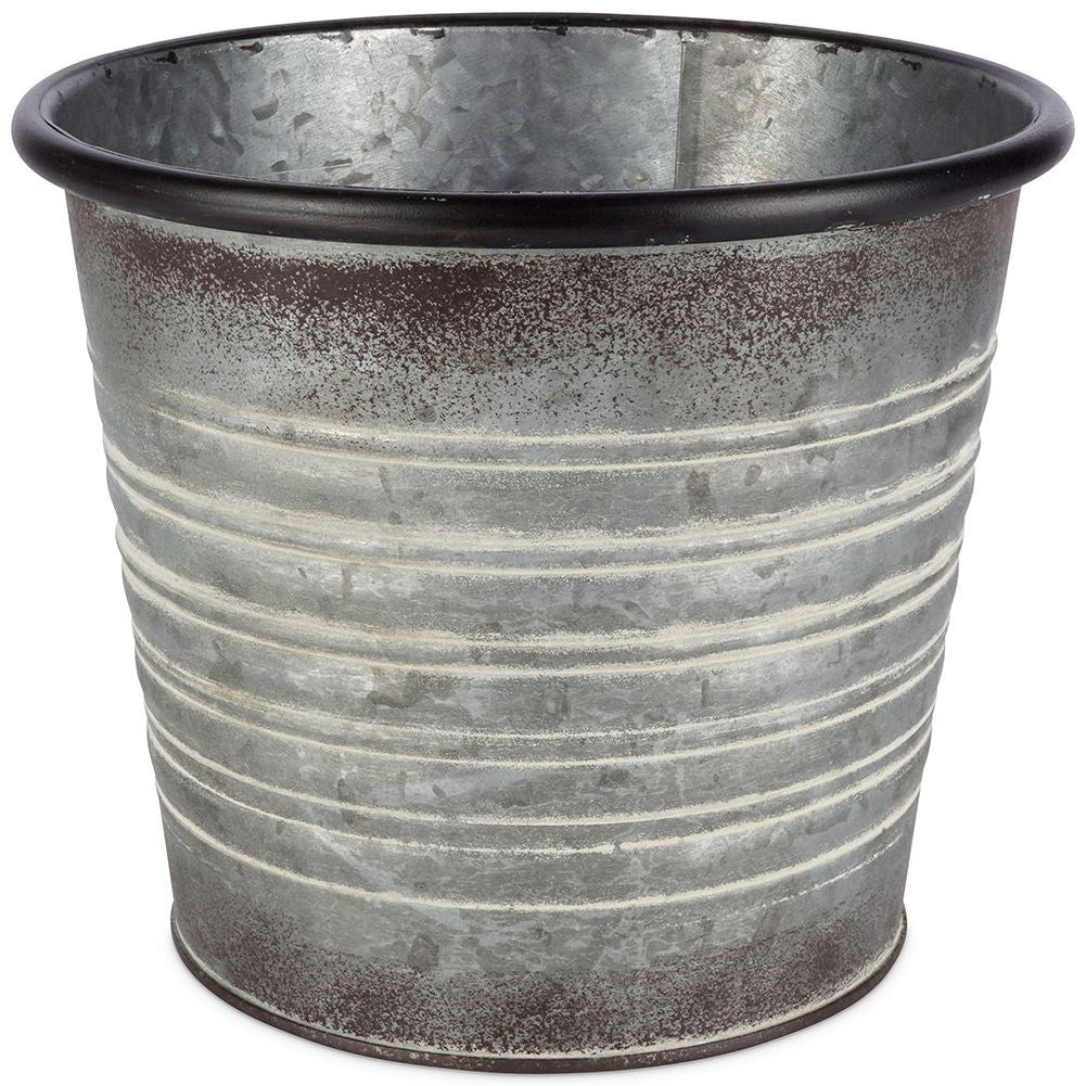 Antique galvanized metal pot with rusty finish