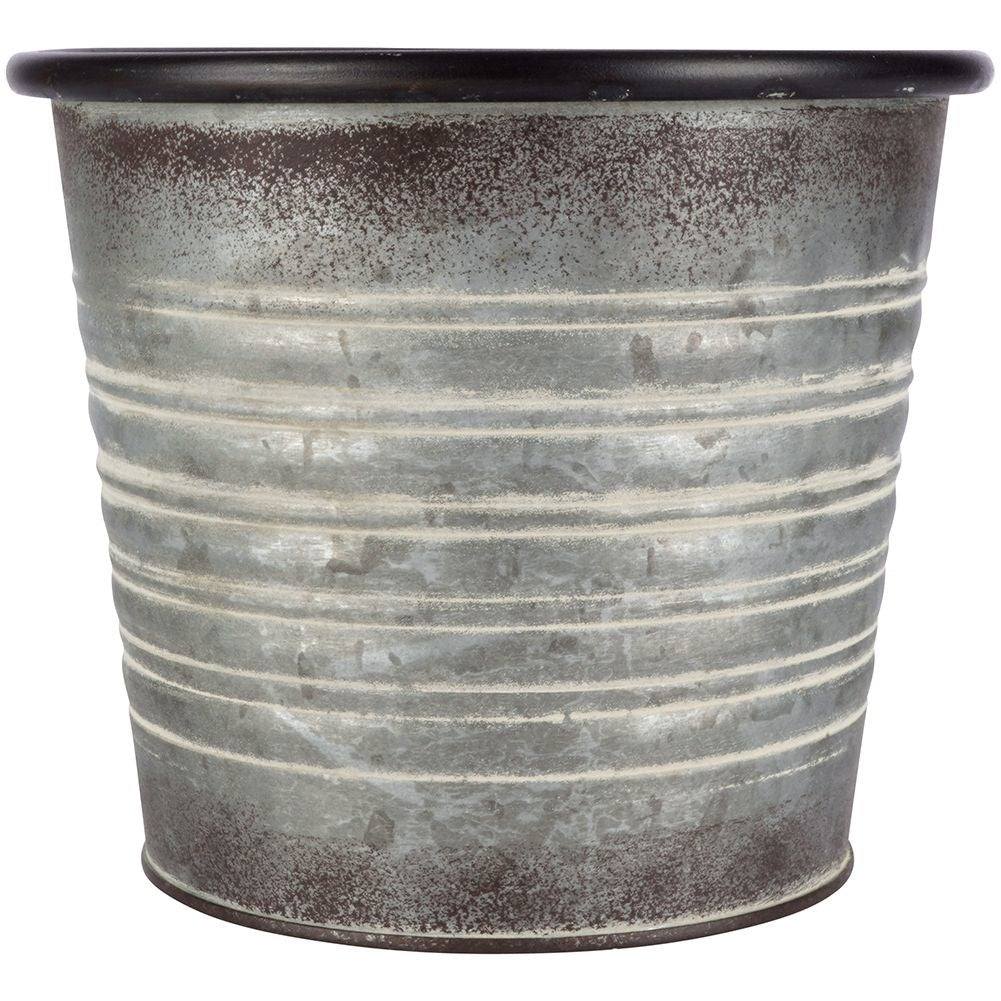 Antique galvanized metal pot with rusty finish