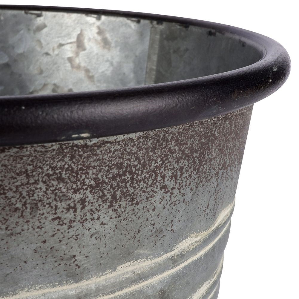 Antique galvanized metal pot with rusty finish