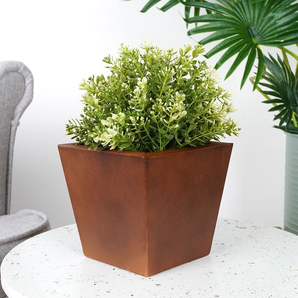 Antique metal pot with rusty effect for flowers and plants