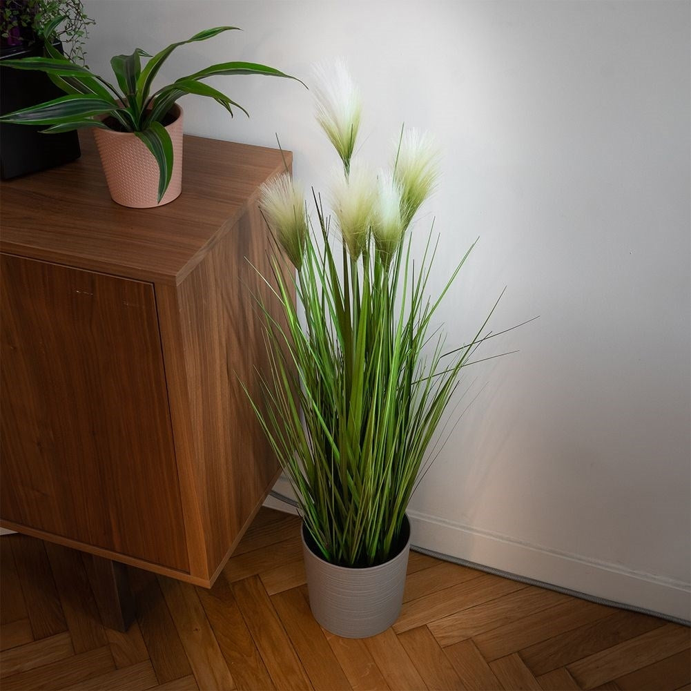 Artificial pampas grass in black pot with five flowers