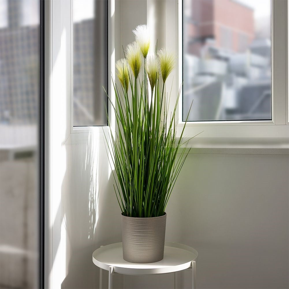 Artificial pampas grass in black pot with five flowers