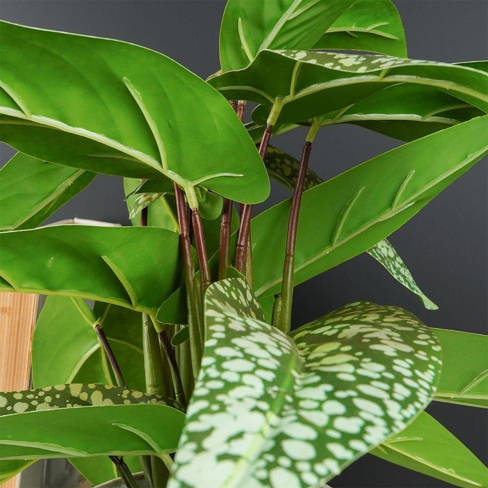 Artificial syngonium plant in decorative pot, realistic and maintenance free