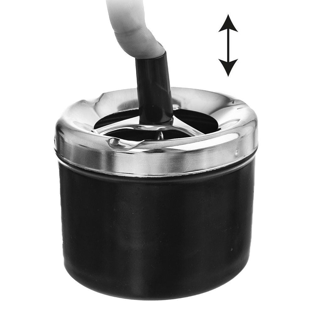 Ashtray with lid that hides cigarette residue and smell