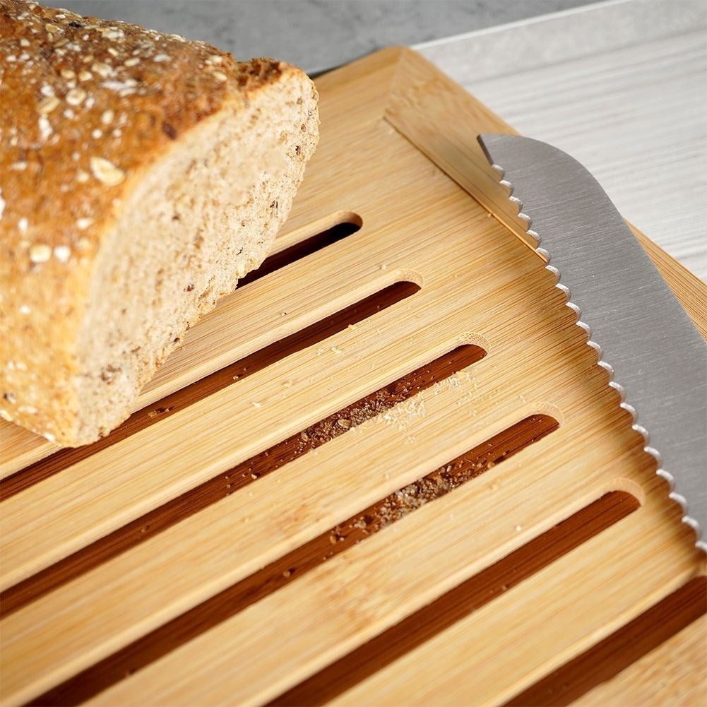 Bamboo cutting board with crumb collector