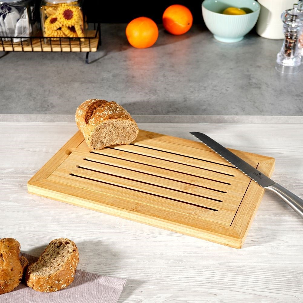 Bamboo cutting board with crumb collector
