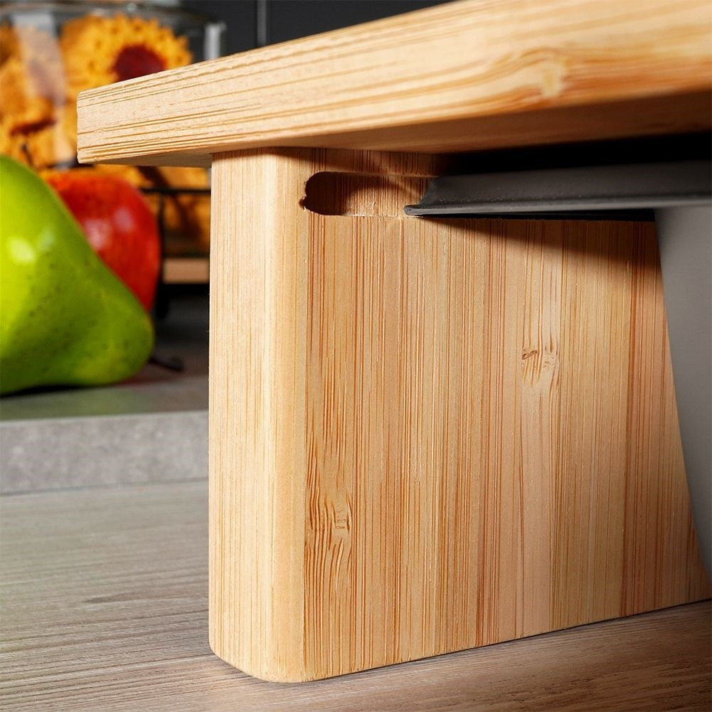 Bamboo cutting board with extendable steel container