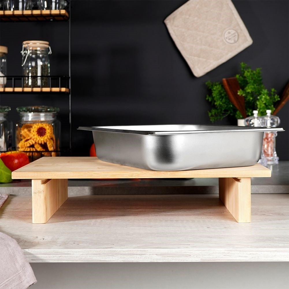 Bamboo cutting board with extendable steel container