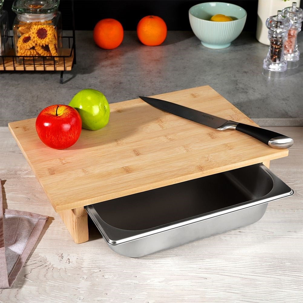 Bamboo cutting board with extendable steel container