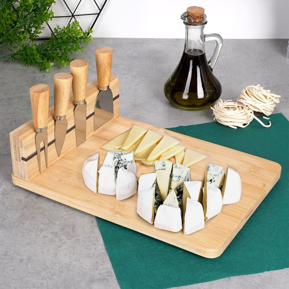 Bamboo cutting board with knife set and magnetic strip for cheeses
