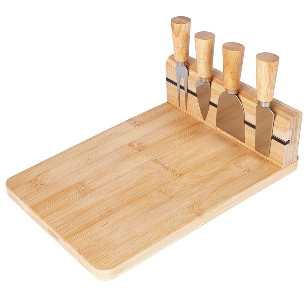 Bamboo cutting board with knife set and magnetic strip for cheeses