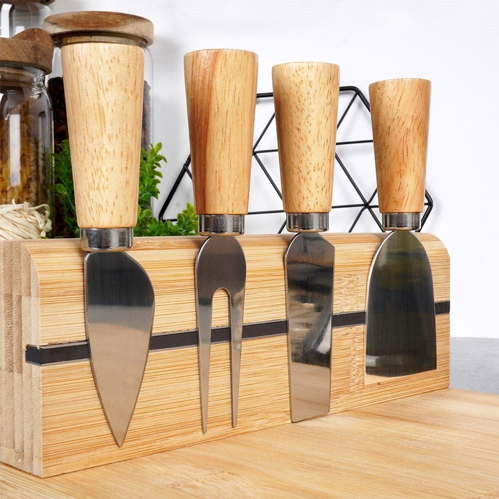 Bamboo cutting board with knife set and magnetic strip for cheeses