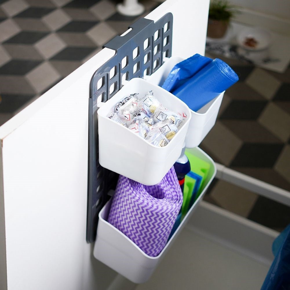 Basket for cabinet doors or shower cubicles with three compartments