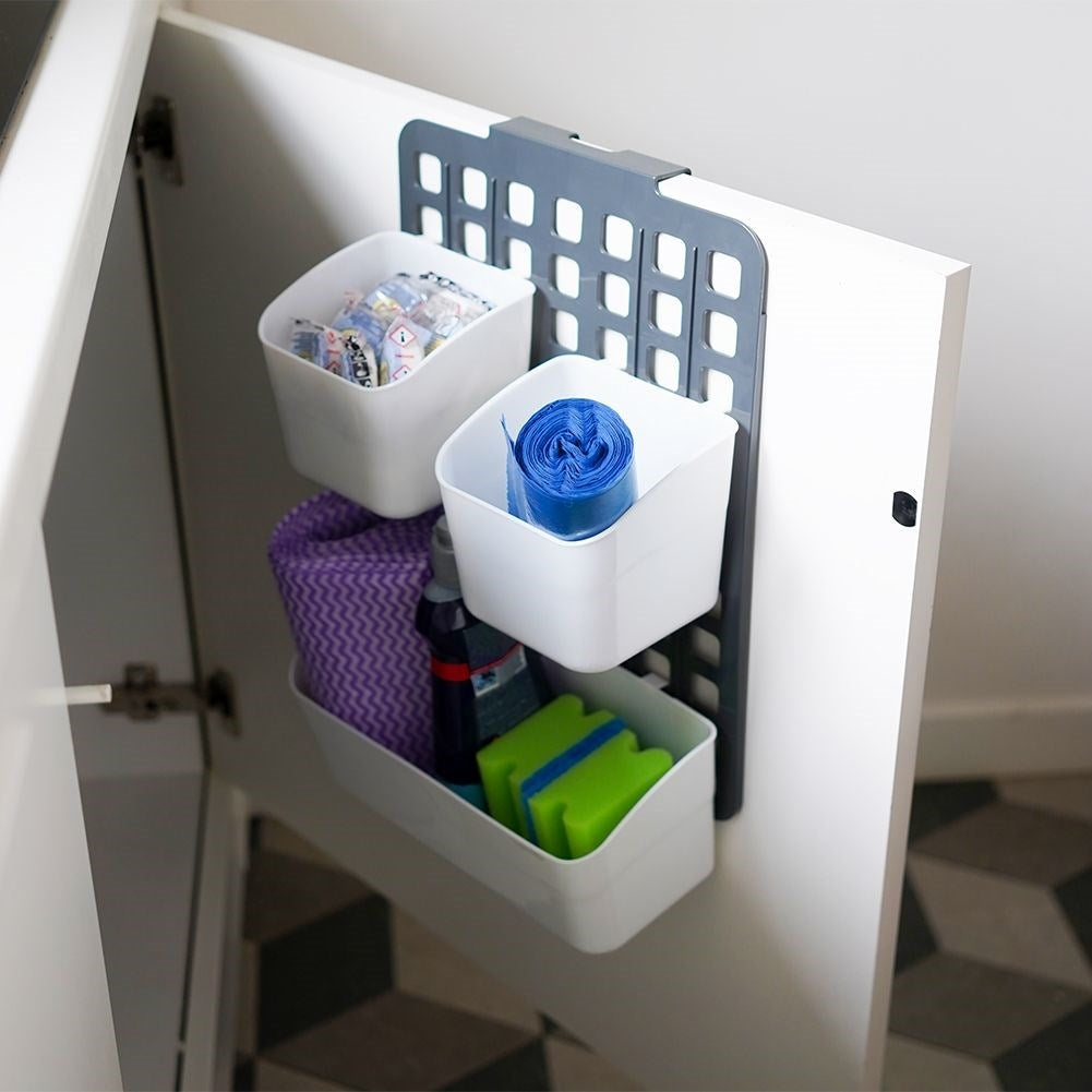 Basket for cabinet doors or shower cubicles with three compartments