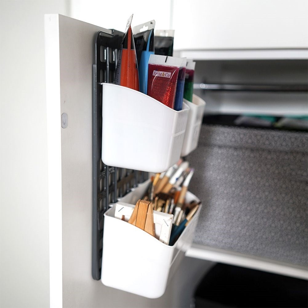 Basket for cabinet doors or shower cubicles with three compartments